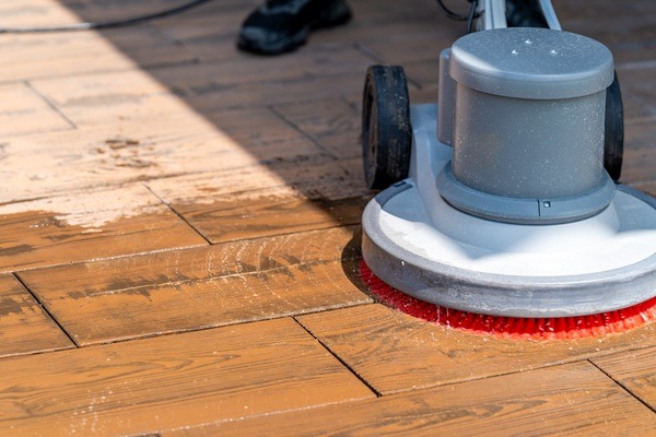 manual cleaning of concrete and stone pavements with a modern mechanical brush